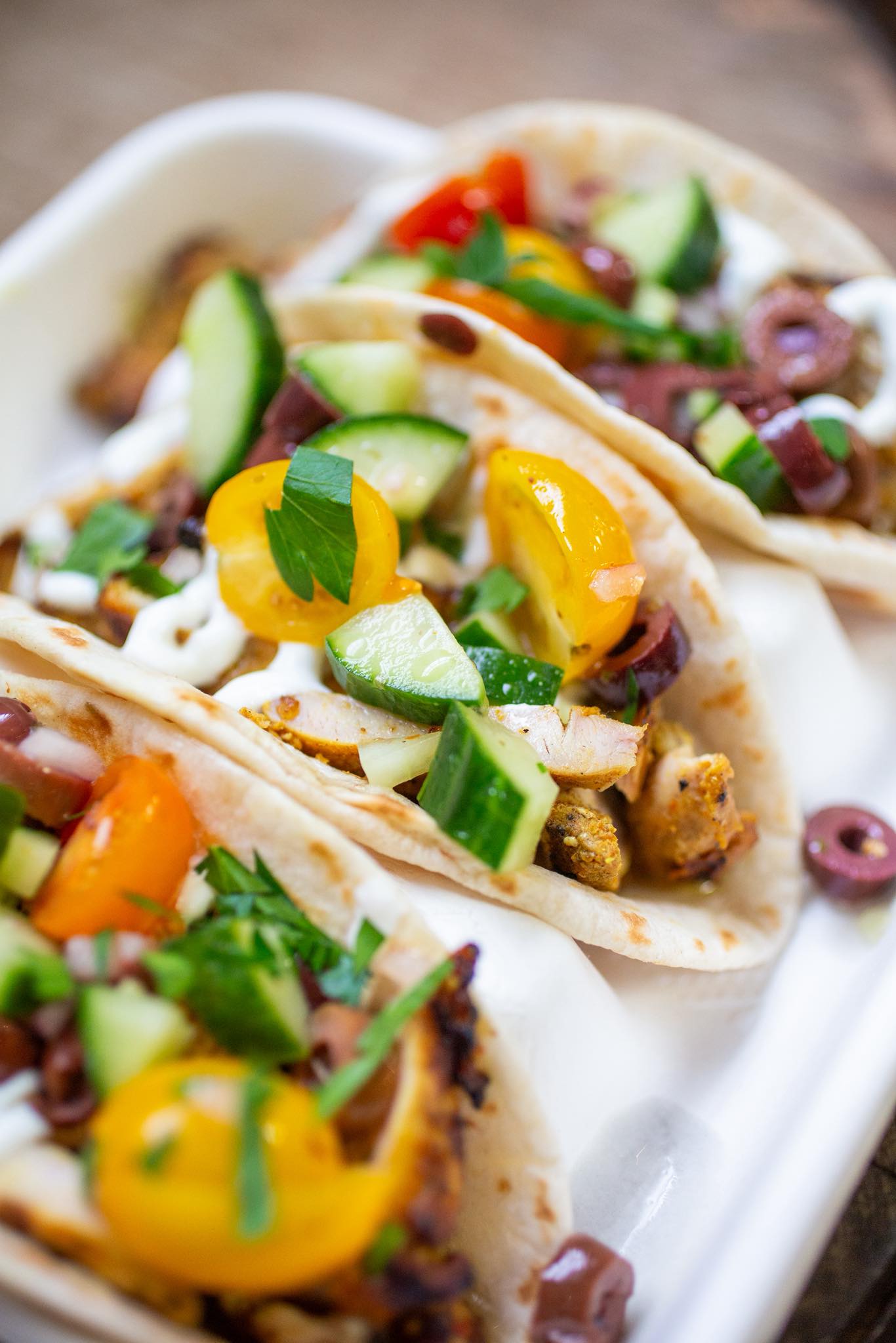 Taco catering spread with fresh toppings and sides from Happy Belly Chefs