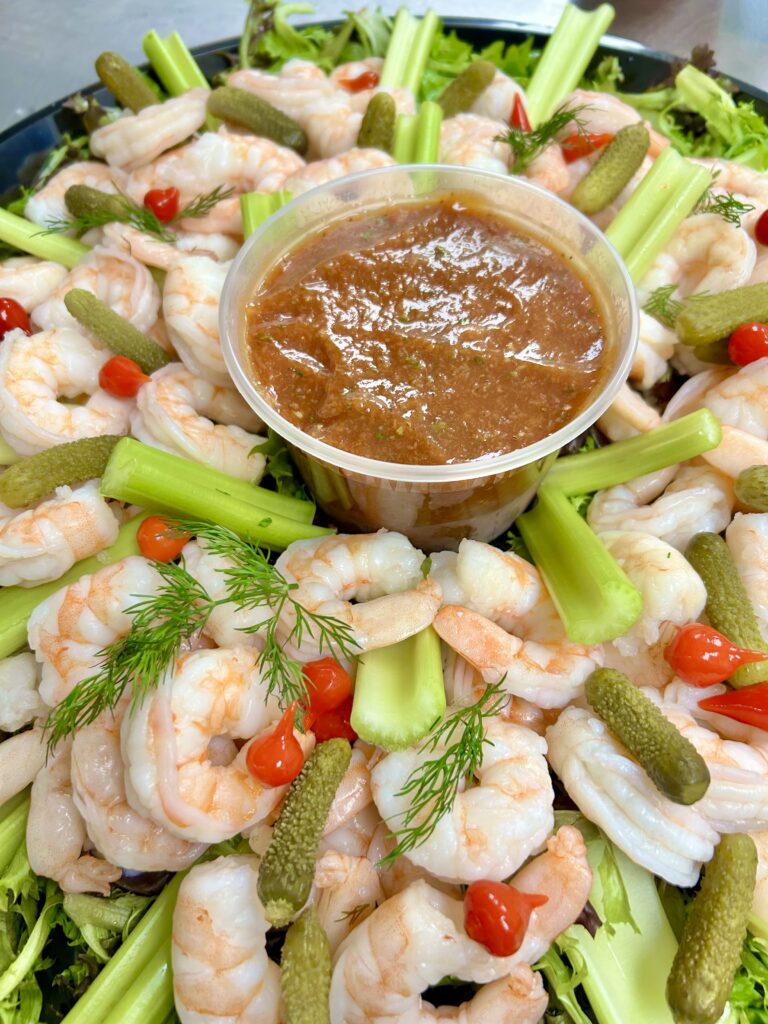 Bloody Mary shrimp with cocktail sauce and bold seasoning from Happy Belly catering